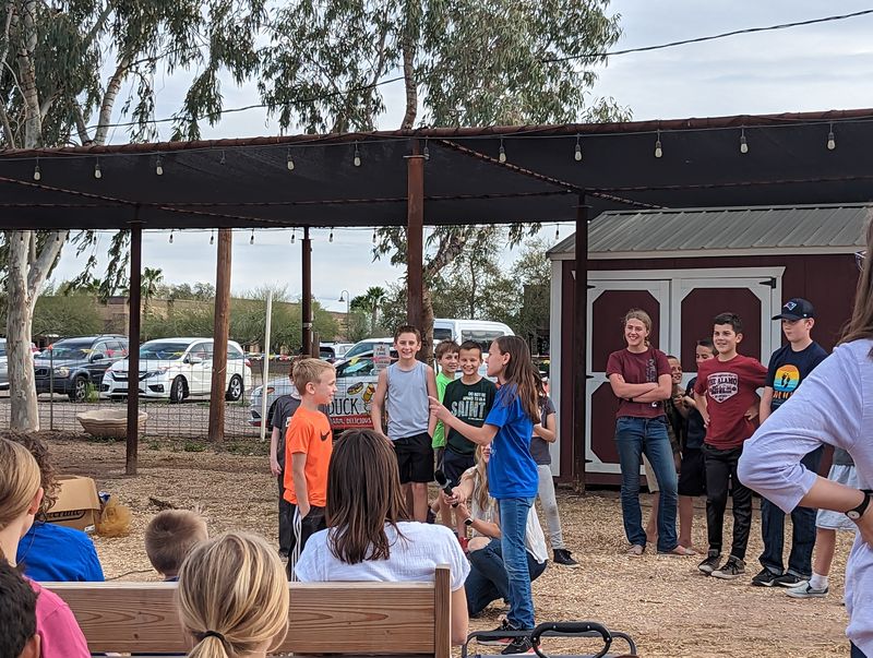 Kids taking part in an improv comedy class on the farm stage.