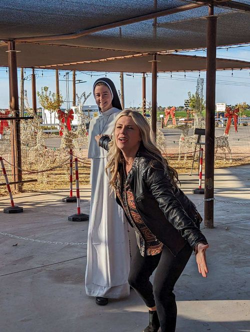 A sister and a Holy Smoke Comedy performer mid-scene at the festival.